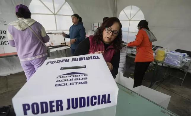 FILE - Electoral officials set up a polling station for the country's first judicial elections in Mexico City, June 1, 2025. (AP Photo/Fernando Llano, File)