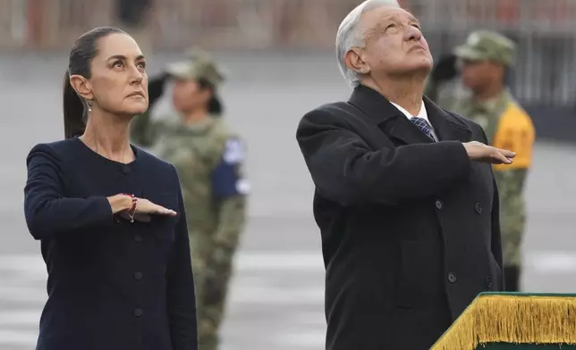 FILE - Mexico's President-elect Claudia Sheinbaum and outgoing President Andres Manuel Lopez Obrador attend an anniversary event at the Zocalo in Mexico City, Sept. 19, 2024. (AP Photo/Fernando Llano, File)