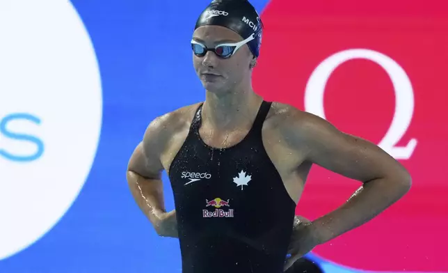 Summer McIntosh of Canada prepares to compete in the women's 800-meter freestyle relay heats at the World Aquatics Championships in Singapore, Friday, Aug.1, 2025. (AP Photo/Vincent Thian)