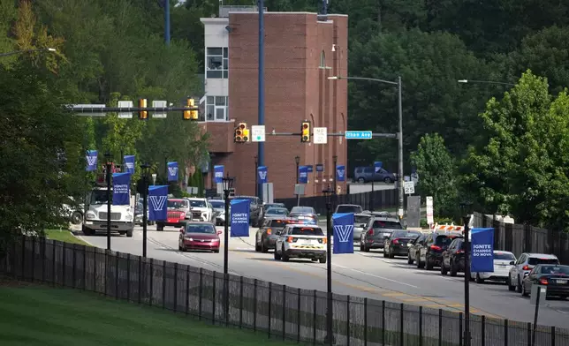 Police vehicles arrive at the Villanova University campus where an active shooter was reported Thursday, Aug. 21, 2025, in Villanova, Pa. (AP Photo/Matt Slocum)
