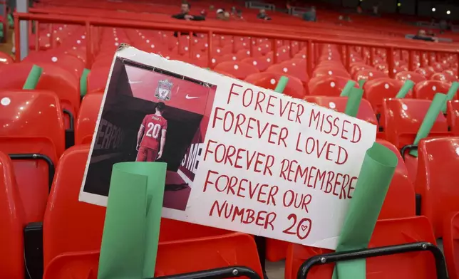 A banner depicting the late Liverpool player Diogo Jota, who died in July, is placed on the stands before the English Premier League soccer match between Liverpool and Bournemouth at Anfield stadium in Liverpool, England, Friday, Aug. 15, 2025. (AP Photo/Ian Hodgson)