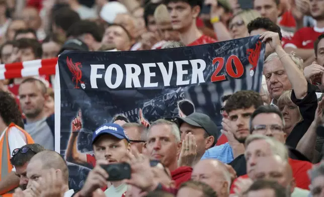 A banner depicting the late Liverpool player Diogo Jota is displayed on the stands before the English Premier League soccer match between Liverpool and Bournemouth at Anfield stadium in Liverpool, England, Friday, Aug. 15, 2025. (AP Photo/Ian Hodgson)