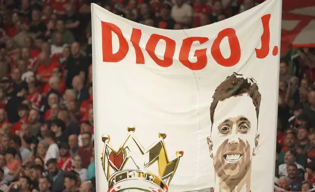 A banner depicting the late Liverpool player Diogo Jota is displayed on the stands before the English Premier League soccer match between Liverpool and Bournemouth at Anfield stadium in Liverpool, England, Friday, Aug. 15, 2025. (AP Photo/Ian Hodgson)