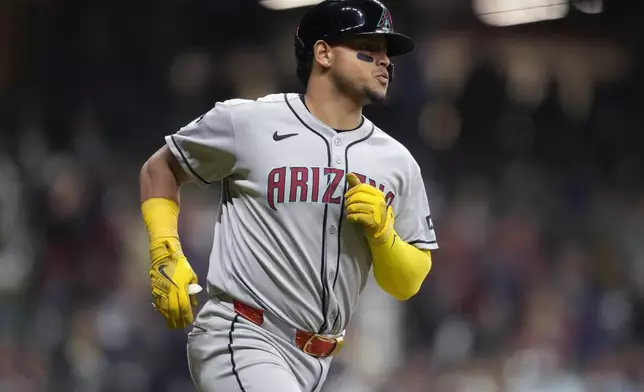 Arizona Diamondbacks' Gabriel Moreno runs the bases after hitting a three-run home run during the fourth inning of a baseball game against the Milwaukee Brewers Tuesday, Aug. 26, 2025, in Milwaukee. (AP Photo/Kayla Wolf)