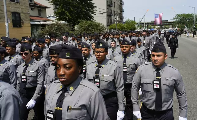 New York Police Academy cadets march outside the Parkchester Jame Masjid mosque for the funeral of officer Didarul Islam, Thursday, July 31, 2025, in New York. (AP Photo/Yuki Iwamura )