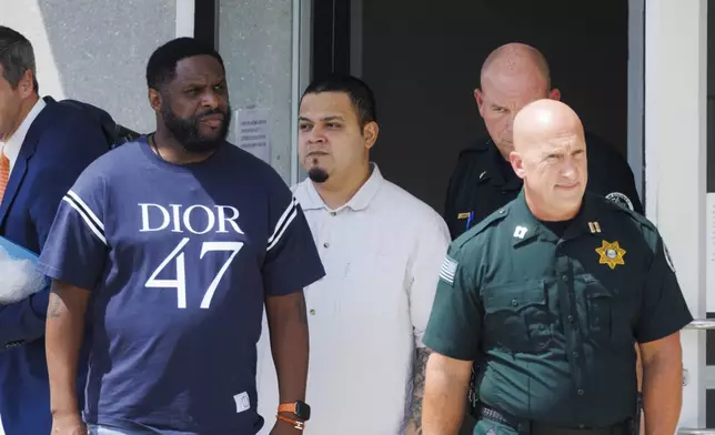 Kilmar Abrego Garcia, third from right, leaves the Putnam County Jail, Friday, Aug. 22, 2025, in Cookeville, Tenn. (AP Photo/Brett Carlsen)