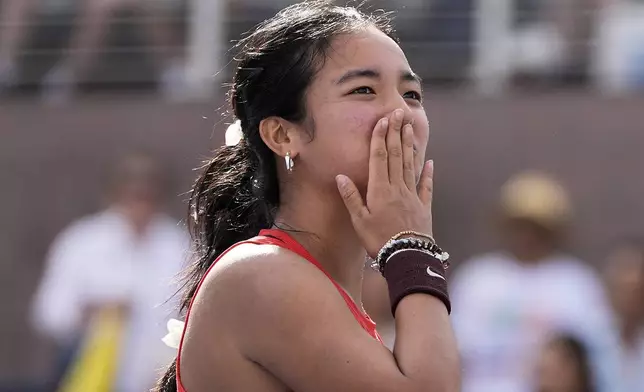 Alexandra Eala, of the Philippines, reacts after defeating Clara Tauson, of Denmark, during the first round of the US Open tennis championships, Sunday, Aug. 24, 2025, in New York. (AP Photo/Seth Wenig)