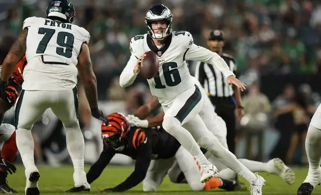 Philadelphia Eagles quarterback Tanner McKee (16) runs with the ball during the first half of an NFL preseason football game against the Cincinnati Bengals on Thursday, Aug. 7, 2025, in Philadelphia. (AP Photo/Matt Slocum)