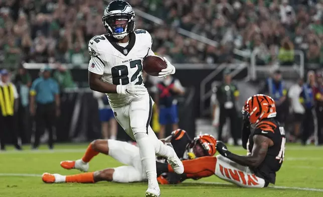 Philadelphia Eagles wide receiver Ainias Smith (82) scores a touchdown during the first half of an NFL preseason football game against the Cincinnati Bengals on Thursday, Aug. 7, 2025, in Philadelphia. (AP Photo/Matt Rourke)