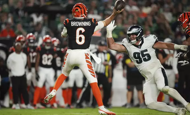 Philadelphia Eagles defensive tackle Ty Robinson (95) pressures Cincinnati Bengals quarterback Jake Browning (6) during the second half of an NFL preseason football game Thursday, Aug. 7, 2025, in Philadelphia. (AP Photo/Matt Slocum)