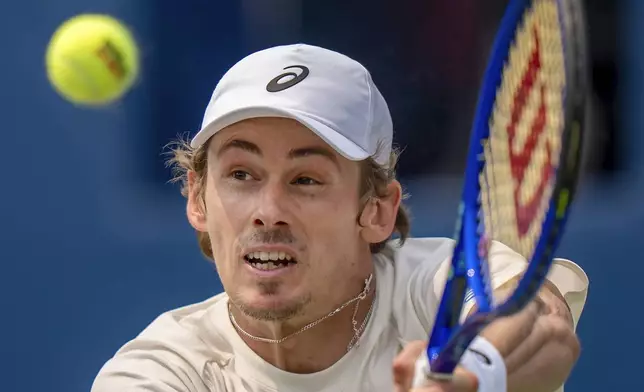 Alex de Minaur, of Australia, hits a backhand return to Frances Tiafoe, of the United States, during their match at the National Bank Open men's tennis tournament in Toronto. (Frank Gunn/The Canadian Press via AP)