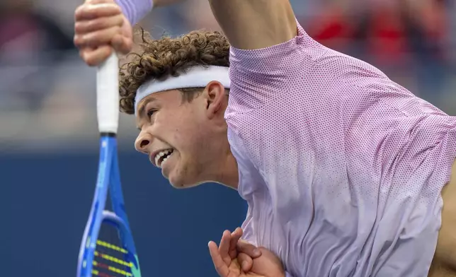 Ben Shelton, of the United States, serves to Flavio Cobolli, of Italy, during their match at the National Bank Open men's tennis tournament in Toronto, Sunday, Aug. 3, 2025. (Frank Gunn/The Canadian Press via AP)