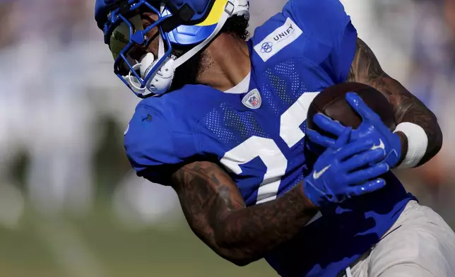 Los Angeles Rams running back Kyren Williams carries the ball during an NFL training camp Tuesday, July 29, 2025, in Los Angeles, Calif. (AP Photo/Eric Thayer)
