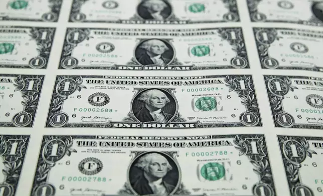 FILE - A sheet of new $1 bills is seen, Nov. 15, 2017, at the Bureau of Engraving and Printing in Washington. (AP Photo/Jacquelyn Martin, File)