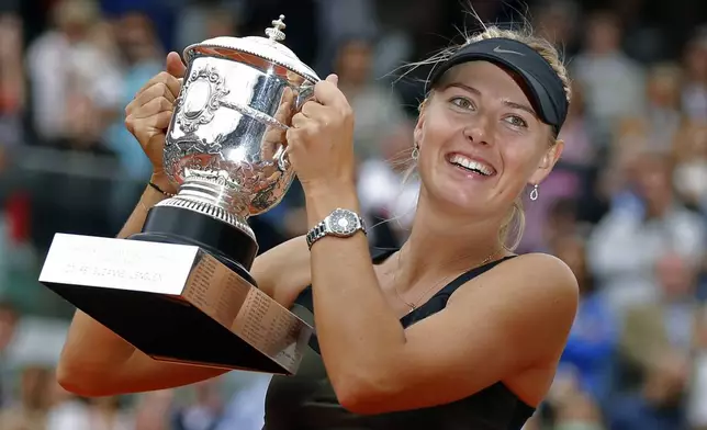 FILE - Maria Sharapova of Russia holds the trophy after winning the women's final match against Sara Errani of Italy at the French Open tennis tournament in Roland Garros stadium in Paris, June 9, 2012. (AP Photo/Michel Euler, File)