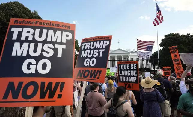 Activists protest President Donald Trump's federal takeover of policing of the District of Columbia, Saturday, Aug. 16, 2025, near the White House in Washington. (AP Photo/Alex Brandon)