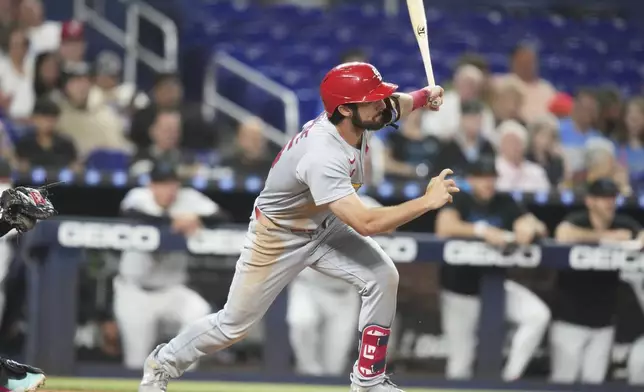 St. Louis Cardinals' Thomas Saggese follows through on a single during the third inning of a baseball game against the Miami Marlins, Tuesday, Aug. 19, 2025, in Miami. (AP Photo/Lynne Sladky)