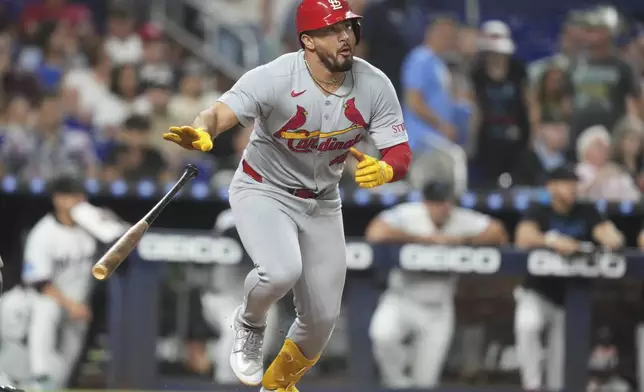 St. Louis Cardinals' Ivan Herrera runs after hitting a RBI single to score two runs during the second inning of a baseball game against the Miami Marlins, Tuesday, Aug. 19, 2025, in Miami. (AP Photo/Lynne Sladky)