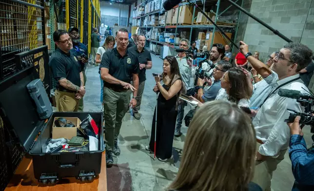 Caleb Bitello, left, ICE Enforcement and Removal Operations (ERO) Academy assistant director and Todd Lyons, second left, acting director of U.S. Immigration and Customs Enforcement (ICE) speak to the press at the Federal Law Enforcement Training Centers (FLETC) in Brunswick, Ga. on Thursday, Aug. 21, 2025 about the training program ICE officers go through. (AP Photo/Fran Ruchalski)