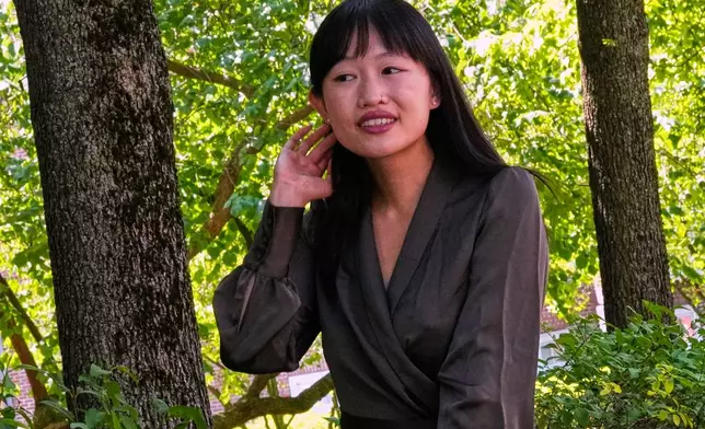 Author R.F. Kuang poses for a portrait near Harvard University in Cambridge, Mass., on Monday, July 28, 2025. (AP Photo/Charles Krupa)