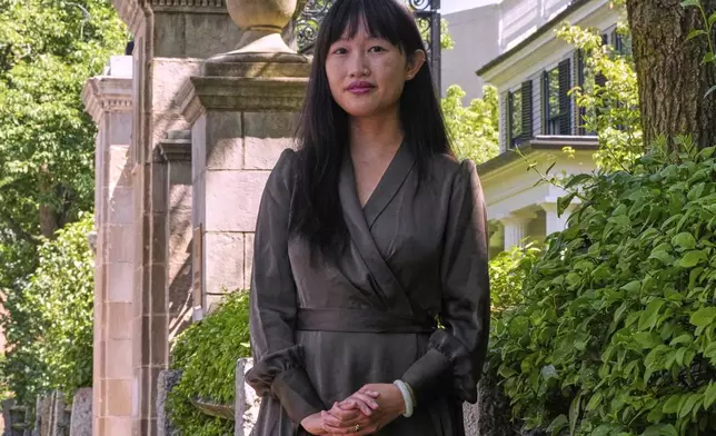 Author R.F. Kuang poses for a portrait near Harvard University in Cambridge, Mass., on Monday, July 28, 2025. (AP Photo/Charles Krupa)