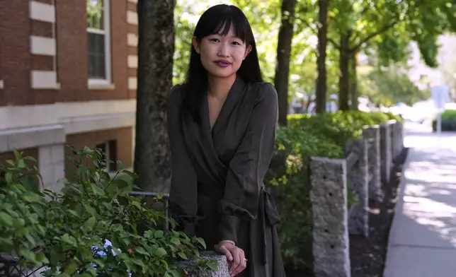 Author R.F. Kuang poses for a portrait near Harvard University in Cambridge, Mass., on Monday, July 28, 2025. (AP Photo/Charles Krupa)
