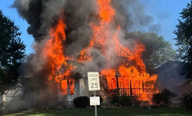 This image provided by the Office of the State Fire Marshal shows a house fire in Waldorf, Md., Sunday, Aug. 10, 2025. (Office of the State Fire Marshal via AP)