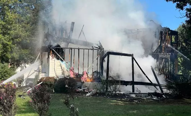This photo provided by the Office of the State Fire Marshal shows a deadly house fire in Waldorf, Md., Sunday, Aug. 10, 2025. (Office of the State Fire Marshal via AP)