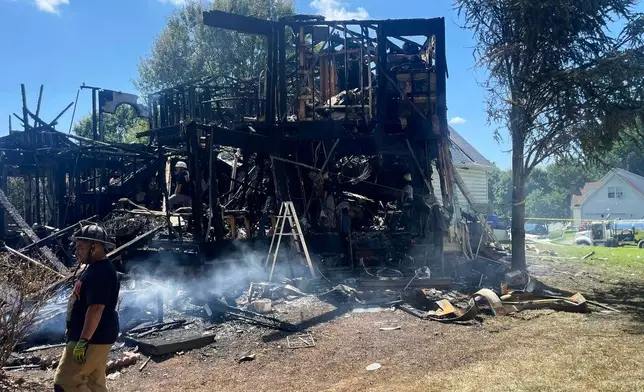 This photo provided by the Office of the State Fire Marshal shows a house fire in Waldorf, Md., Sunday, Aug. 10, 2025. (Office of the State Fire Marshal via AP)