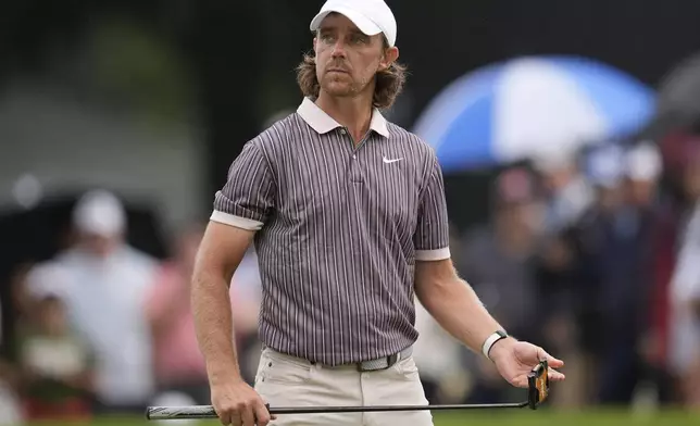 Tommy Fleetwood, of England, walks off the 11th green during the third round of the Tour Championship golf tournament, Saturday, Aug. 23, 2025, in Atlanta. (AP Photo/Mike Stewart)