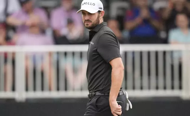 Patrick Cantlay walks on the 18th green during the third round of the Tour Championship golf tournament, Saturday, Aug. 23, 2025, in Atlanta. (AP Photo/Mike Stewart)