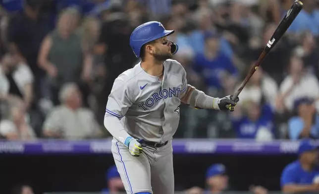 Toronto Blue Jays' Bo Bichette heads up the first base line after hitting a three-run home run off Colorado Rockies relief pitcher Carson Palmquist in the seventh inning of a baseball game Monday, Aug. 4, 2025, in Denver. (AP Photo/David Zalubowski)