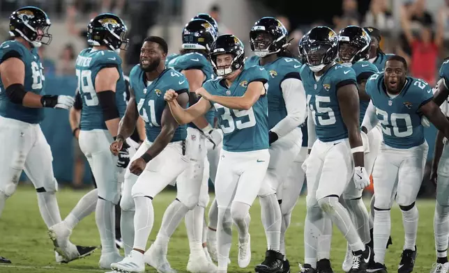 Jacksonville Jaguars place kicker Cam Little (39) celebrates a field goal during the first half of an NFL preseason football game against the Pittsburgh Steelers, Saturday, Aug. 9, 2025, in Jacksonville, Fla. (AP Photo/John Raoux)