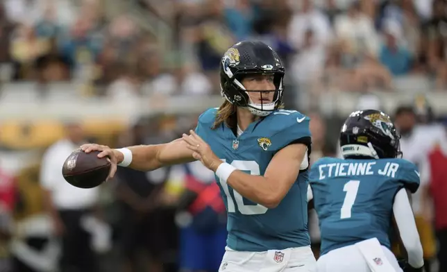 Jacksonville Jaguars quarterback Trevor Lawrence throws during the first half of an NFL preseason football game against the Pittsburgh Steelers, Saturday, Aug. 9, 2025, in Jacksonville, Fla. (AP Photo/John Raoux)