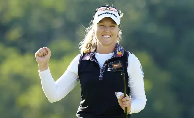Brooke Henderson, of Canada celebrates, after winning the Canadian Women's Open golf tournament on the 18th hole in Mississauga, Ontario, Sunday, Aug. 24, 2025. (Frank Gunn/The Canadian Press via AP)