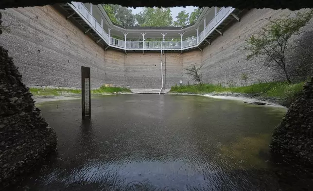 A water gauge measure discharge from White Sulphur Spring, that was a sacred place for Apalachee and Timucuan tribes, Tuesday, July 15, 2025, in White Springs, Fla. (AP Photo/Marta Lavandier)