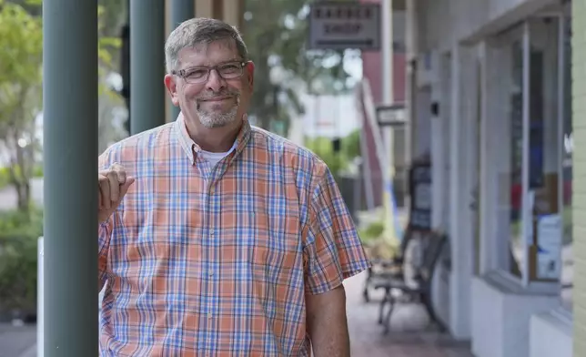 Steven Spina, a member of the Zephyrhills, Fla., town council, poses Wednesday, July 30, 2025, in the historic district of Zephyrhills. (AP Photo/Marta Lavandier)