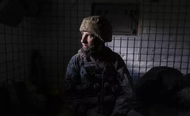 In this photo provided by Ukraine's 93rd Kholodnyi Yar Separate Mechanized Brigade press service, a soldier looks on in a shelter on the frontline near Kostyantynivka in Donetsk region, Ukraine, Tuesday, Aug. 26, 2025. (Iryna Rybakova/Ukraine's 93rd Mechanized Brigade via AP)