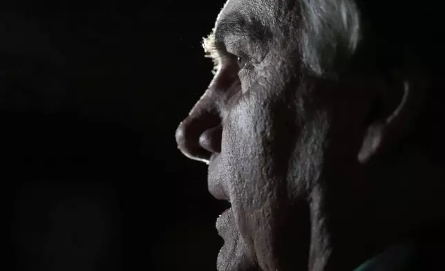 FILE - Former President Jair Bolsonaro talks with reporters after arriving at the airport in Brasilia, Brazil, June 30, 2023, days after he was barred from running for office again until 2030 after a panel of judges concluded that he abused his power and cast unfounded doubts on the country's electronic voting system. (AP Photo/Eraldo Peres, File)