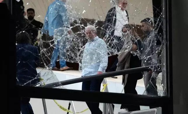 FILE - Brazil's President Luiz Inacio Lula da Silva surveys the damage at the Planalto Palace after it was stormed by supporters of former President Jair Bolsonaro, in Brasilia, Brazil, Jan. 8, 2023. (AP Photo/Eraldo Peres, File)