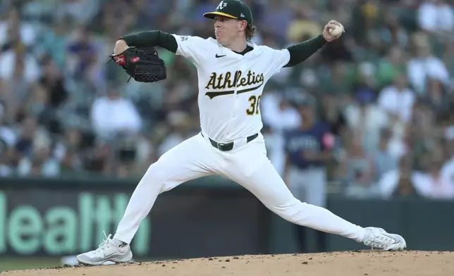 Athletics pitcher JP Sears throws to an Seattle Mariners batter during the second inning of a baseball game Monday, July 28, 2025, in West Sacramento, Calif. (AP Photo/Scott Marshall)