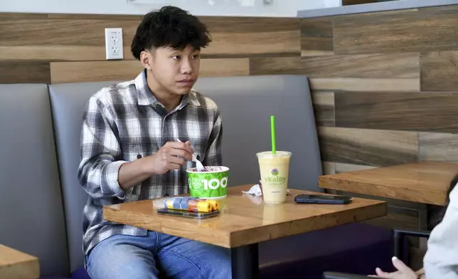 Braxton Kimura eats at Vitality Bowl on Wednesday, Aug. 13, 2025, in San Jose, Calif. (AP Photo/Terry Chea)