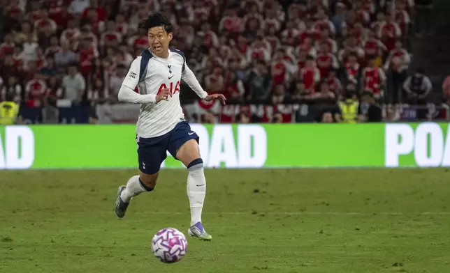 Tottenham Hotspur's Son Heung-min chases the ball during a friendly soccer match between Arsenal FC and Tottenham Hotspur, Thursday, July 31, 2025, at the Hong Kong Football Festival at the Kai Tak Stadium in Hong Kong. (AP Photo/Chan Long Hei)