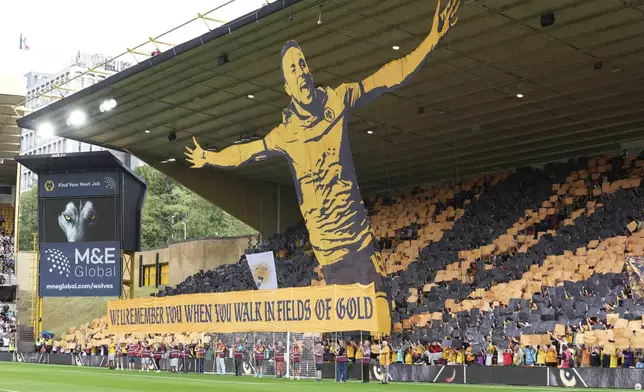 Fans pay a tribute to late Liverpool player Diogo Jota ahead of the English Premier League soccer match between Wolverhampton Wanderers and Manchester City at Molineux Stadium, Wolverhampton, England, Saturday, Aug. 16, 2025. (AP Photo/Dave Shopland)