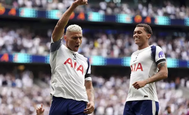 Tottenham Hotspur's Richarlison, left, celebrates scoring the opening goal during the the English Premier League soccer match between Tottenham Hotspur and Burnley at the Tottenham Hotspur Stadium in London, Saturday, Aug. 16, 2025. (Adam Davy/PA via AP)