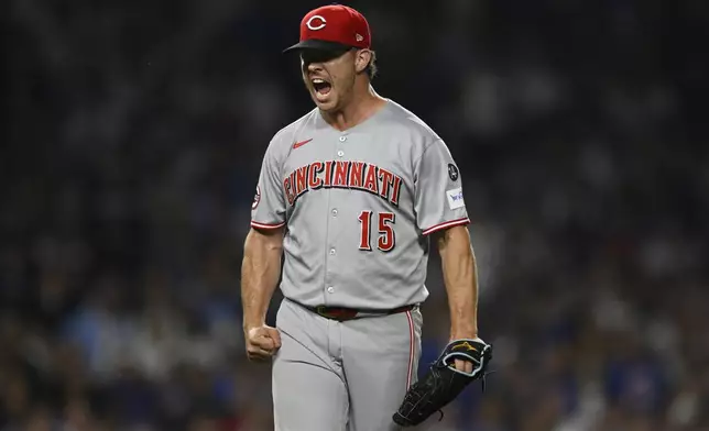 Cincinnati Reds closing pitcher Emilio Pagan celebrates after defeating the Chicago Cubs in a baseball game Monday, Aug. 4, 2025, in Chicago. (AP Photo/Paul Beaty)