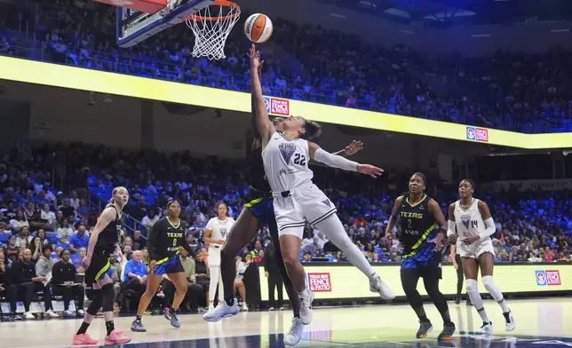 Golden State Valkyries guard Veronica Burton (22) drives to the basket against Dallas Wings forward Diamond Miller, center back, during the second half of a WNBA basketball game in Arlington, Texas, Sunday, Aug. 24, 2025. (AP Photo/LM Otero)
