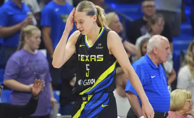 Dallas Wings guard Paige Bueckers reacts after a play during the first half of a WNBA basketball game against the Golden State Valkyries in Arlington, Texas, Sunday, Aug. 24, 2025. (AP Photo/LM Otero)