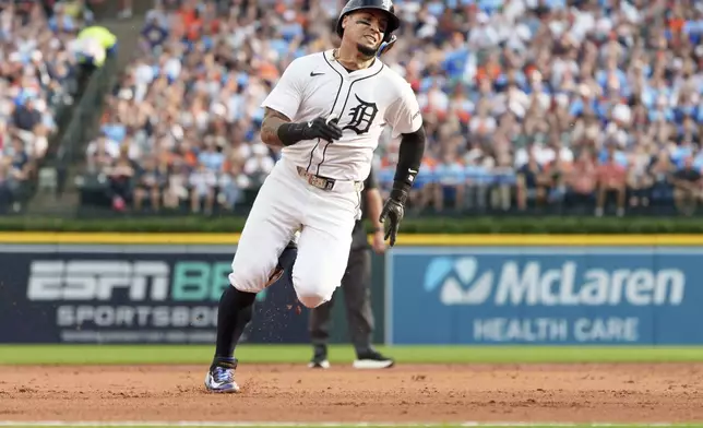 Detroit Tigers' Javier Báez runs to third base during the third inning of a baseball game Kansas City Royals Saturday, Aug. 23, 2025, in Detroit. (AP Photo/Josh Boland )