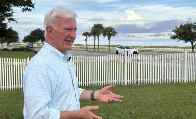 Overlooking the Mississippi Sound, Allen Baker talks in front of his home, Aug. 12, 2025, in Gulfport, Miss. (AP Photo/Jeff Amy)